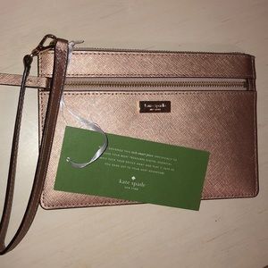 Gold Kate Spade Wristlet.